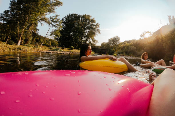 istock Relaxing on inflatable rings in the river 1220723078