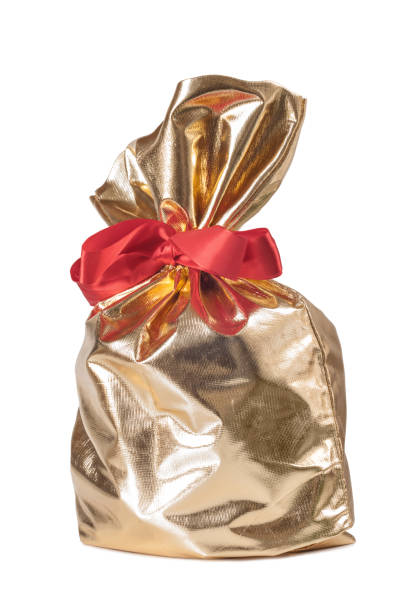 istock Golden gift bag with a red bow 1220723082