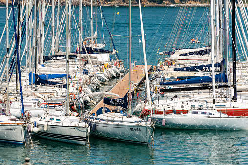 Lerici, La Spezia, Italy - July 19th, 2014: Large group of sailboats moored in the Lerici port, typical seaside town in Liguria in the Gulf of La Spezia, Italy, Europe