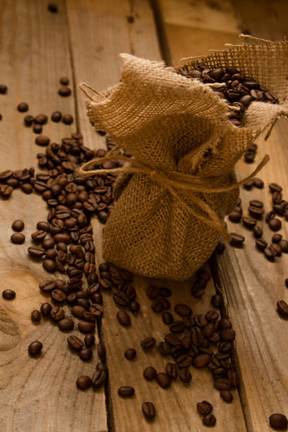istock Coffee beans in a little jute bag. 1220727149