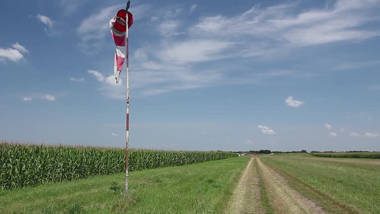 Red and white windsock shows wind blow direction