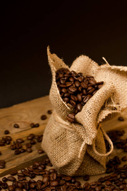 istock Coffee beans in a little jute bag. 1220727302