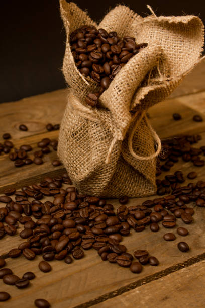 istock Coffee beans in a little jute bag. 1220727367