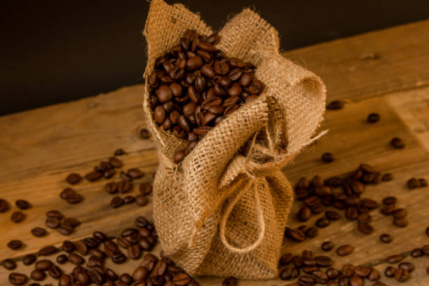 istock Coffee beans in a little jute bag. 1220727491