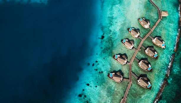 istock Maldives Island Lagoon with Water Villas 1220728820