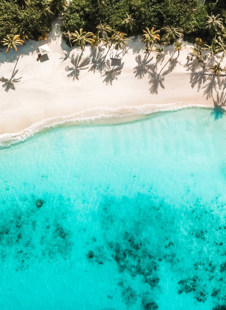 istock Maldives Island Beach Villas at Lagoon from above 1220728821