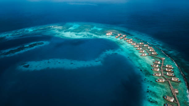 istock Maldives Island Lagoon with Over Water Villas 1220728823