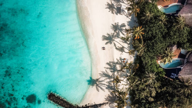 istock Maldives Island Beach Villas at Lagoon from above 1220728838