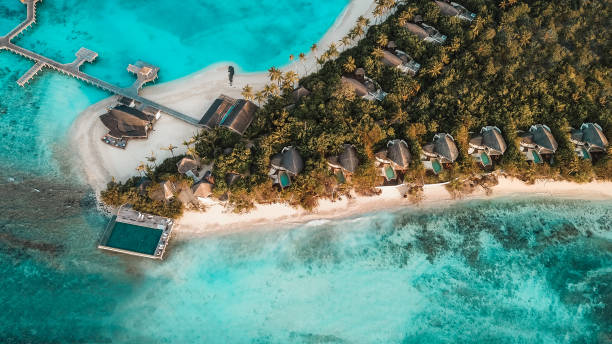 istock Sunrise over Maldives island lagoon 1220728850