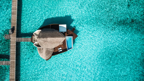 istock Maldives Island Resort Over Water Villas 1220728862