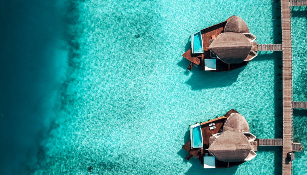 istock Maldives Island Resort Over Water Villas 1220728892
