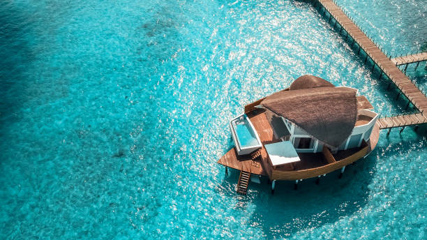 istock Maldives Island Resort Over Water Villas 1220728896