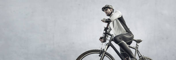 istock Man with a mountain bike panorama 1220729215