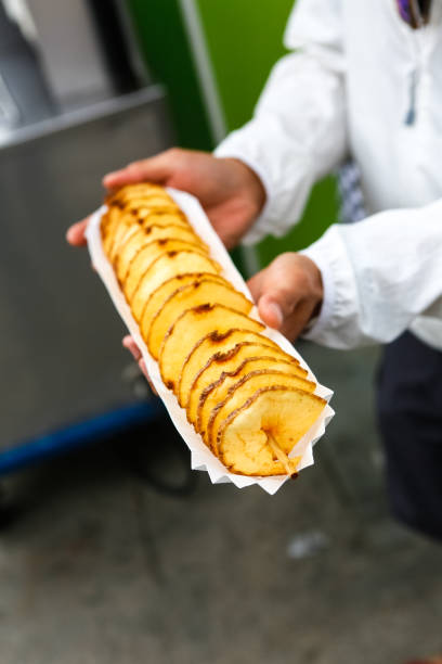 istock Spiral cut potato snack at a carnival 1220729309