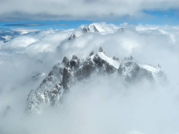 istock Mont Blanc peak in the clouds, Chamonix France 1220729320