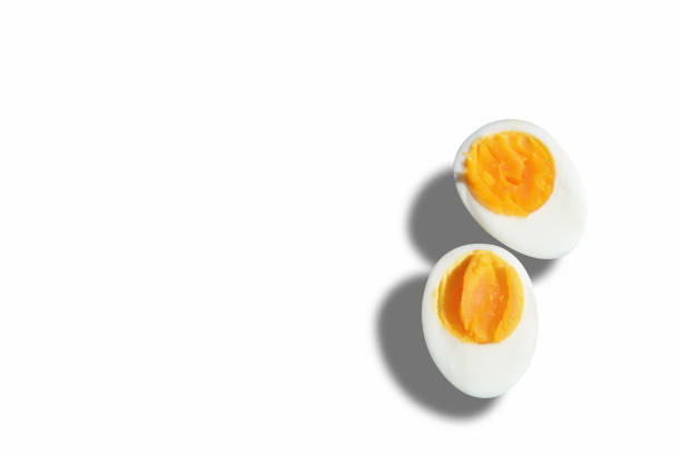 Boiled egg with shadow on white background Food concept and copy space idea boiled egg photos stock pictures, royalty-free photos & images