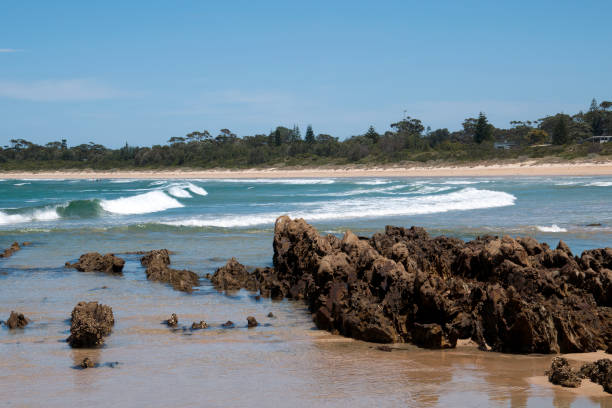 istock View across bay with surf to sandy beach 1220730210