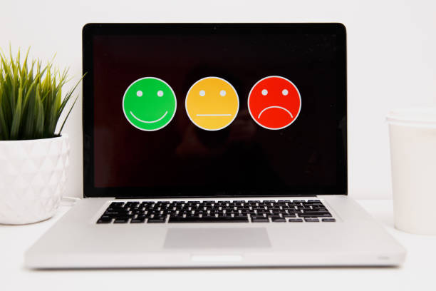 istock man putting on excellent smiley face rating for a satisfaction survey, Customer experience 1220730468