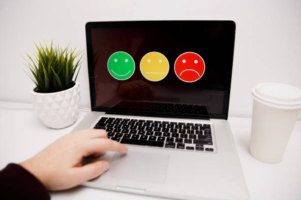 istock man putting on excellent smiley face rating for a satisfaction survey, Customer experience 1220730494