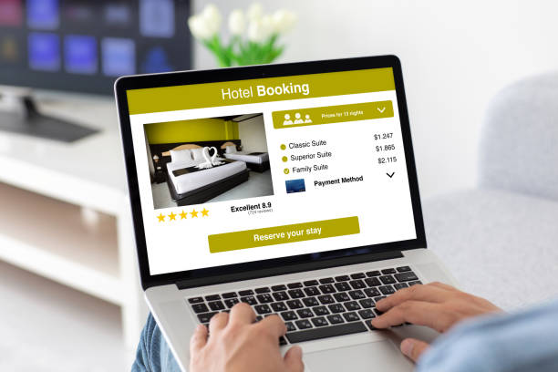 istock male hands on keyboard laptop with app hotel booking 1220730609