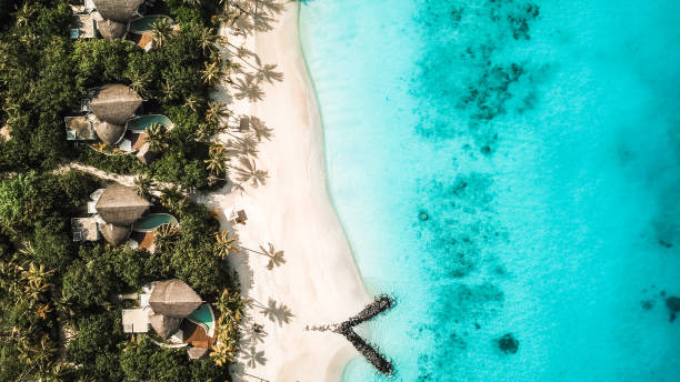 istock Maldives Island Beach Villas at Lagoon from above 1220730627