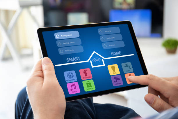 istock male hands holding computer tablet with app smart home 1220731522