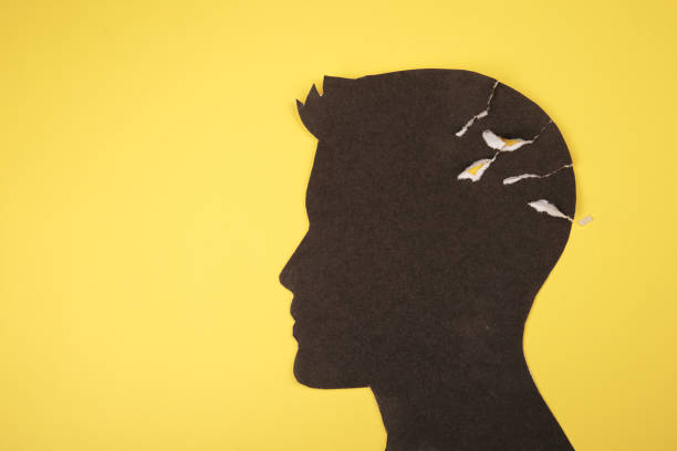 istock Brain disorder symbol presented by human head made form paper . Creative idea for Alzheimer's disease, dementia, memory loss and mental 1220731815