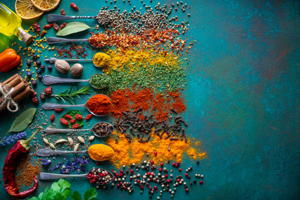 istock Spices herbs seasoning condiments on vintage spoons 1220736603