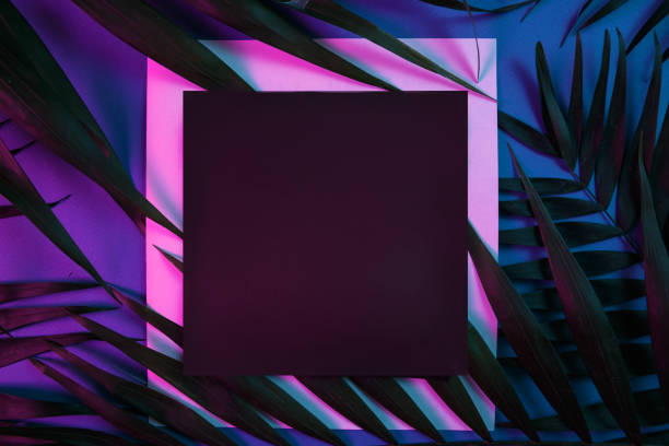 istock Tropical and palm leaves in vibrant bold gradient holographic neon colors 1220736743