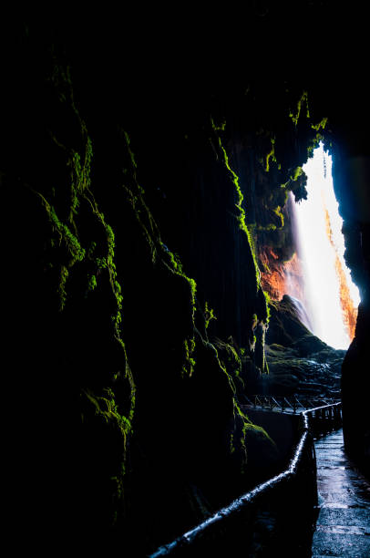 istock Interior of a huge cave hidden behind a large waterfall 1220737443