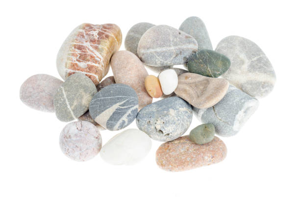 istock Pile of gray sea smooth pebbles isolated on white background. 1220737518