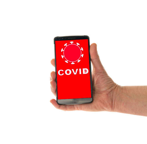 istock female hand with mobile corona phone app 1220737637