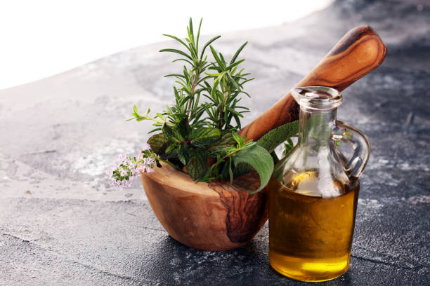 istock Homegrown and aromatic herbs on rustic background with rosemary and basil 1220737810