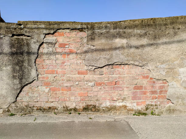istock Creepy brick wall of an old warehouse 1220739223