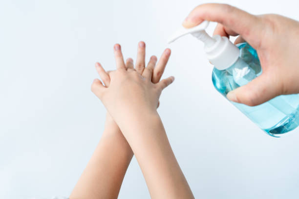 Hands being disinfected with hand sanitizer Hands being disinfected with hand sanitizer wuxi photos stock pictures, royalty-free photos & images