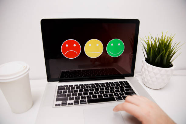 istock man putting on excellent smiley face rating for a satisfaction survey, Customer experience 1220740141