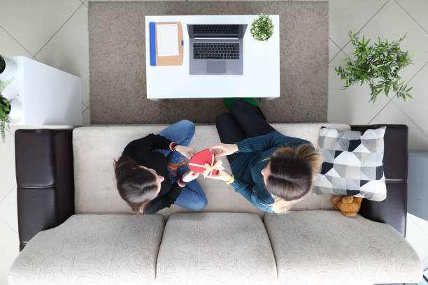 istock Laptop and plant on coffee table 1220740617