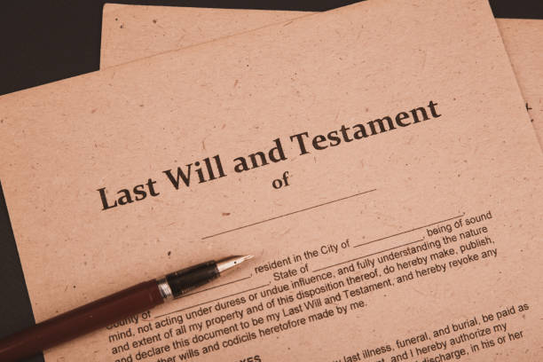 istock Notary's public pen and stamp on testament and last will. Notary public 1220741094