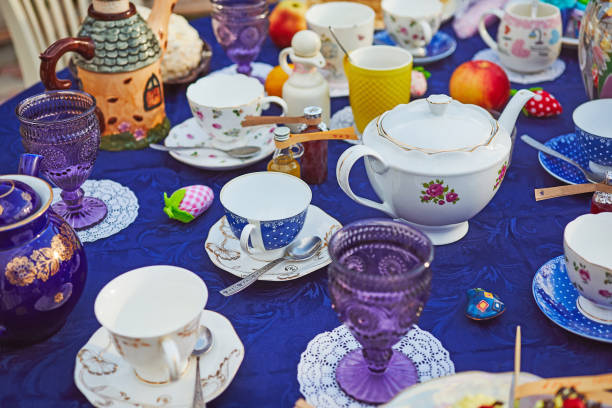 Tea party with cupcakes and different colorful cups stock photo