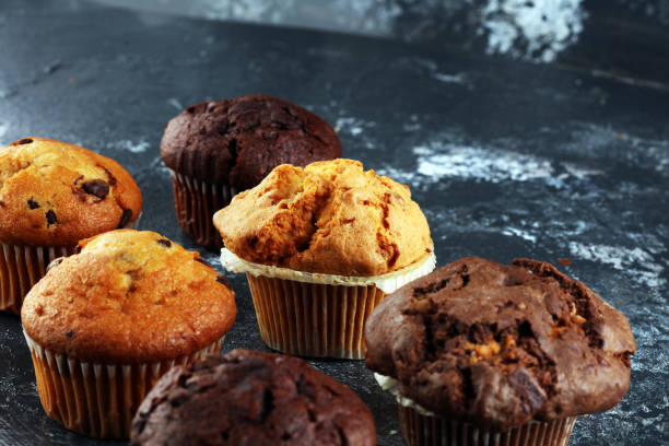 istock Chocolate muffin and nut muffin, homemade bakery on background. 1220741184