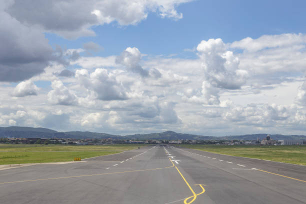 Looking down the runway at Florence airport, Tuscany, Italy. The runway of Peretola or Florence Airport in Italy. florence italy airport stock pictures, royalty-free photos & images