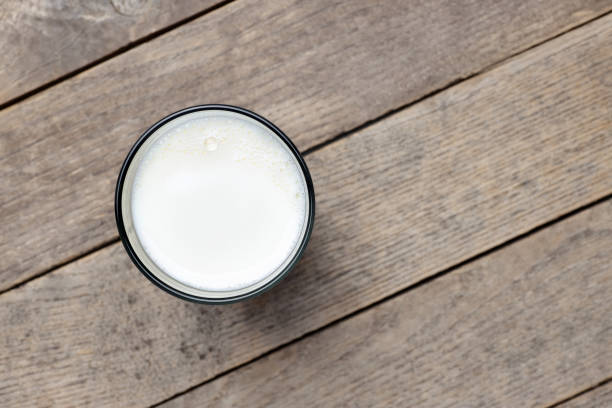 istock milk pouring into glass 1220742383