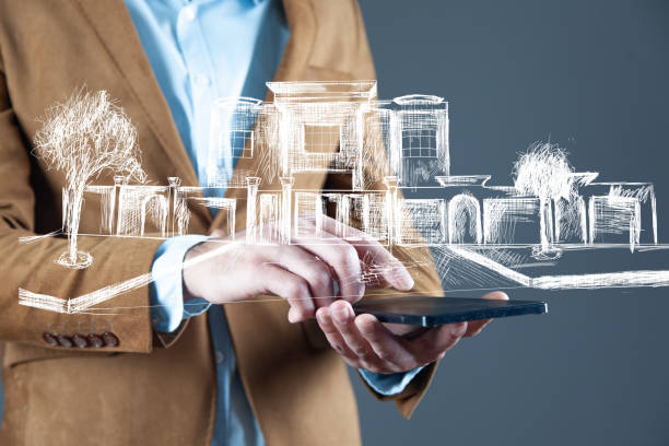 istock man hand tablet with buildings in screen 1220742764