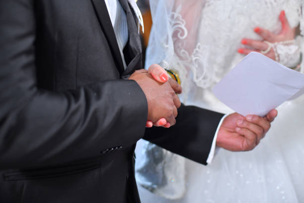 istock Joined hands of  groom and bride. 1220743808