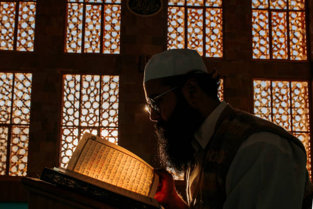 istock Muslim man is reading the Quran in the mosque 1220747659