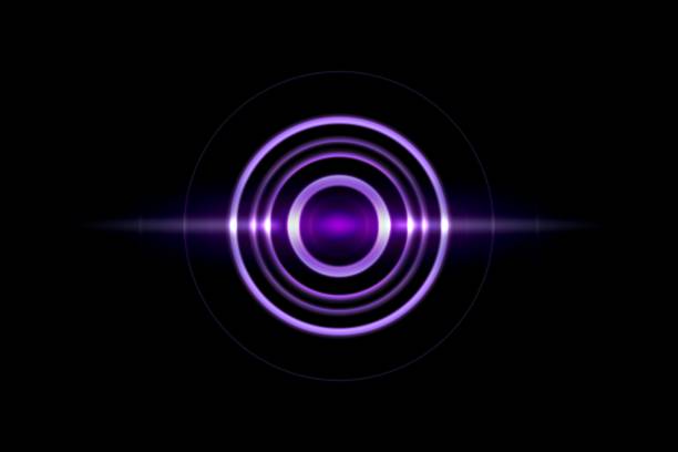 istock Purple spiral with light circle ring on black backdrop, abstract background 1220749659