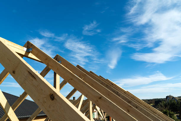 istock Roof trusses not covered with ceramic tile on a detached house under construction, visible roof elements, battens, counter battens, rafters. Industrial roof system with wooden timber 1220750335