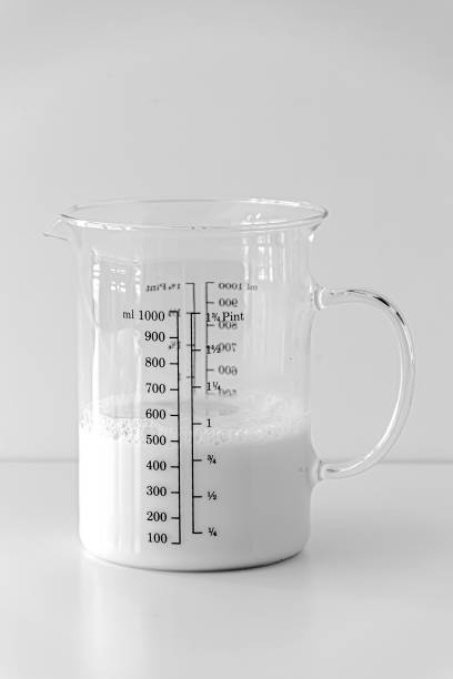 istock Soy Milk In The Measuring Cup On White Background 1220750914