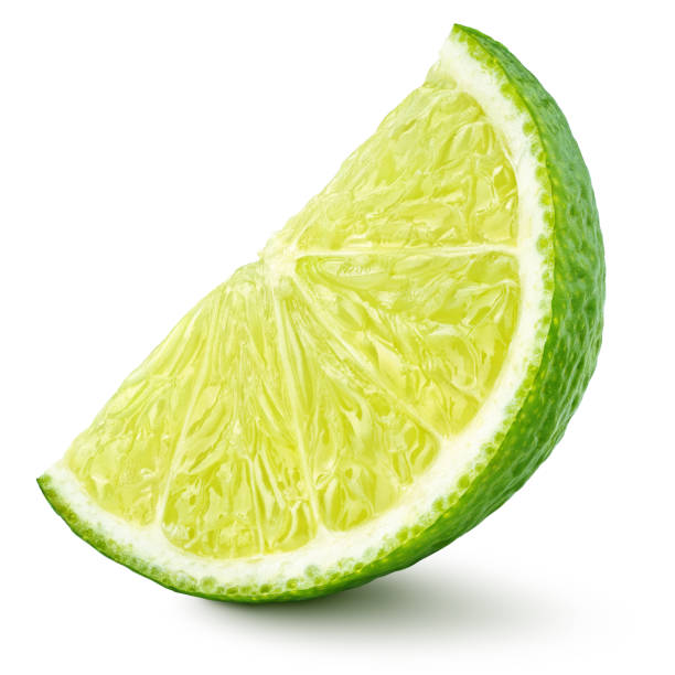 istock wedge of lime citrus fruit isolated on white 1220751154