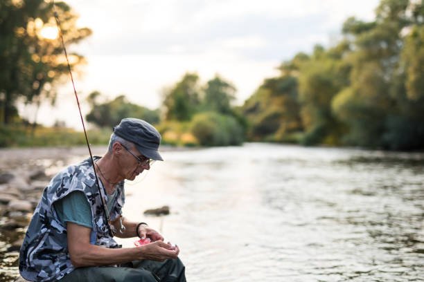 istock Fisherman choosing bite for fishing 1220751444